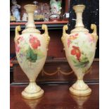 A pair of early 20thC Royal Worcester blush ivory china, twin handled vases,