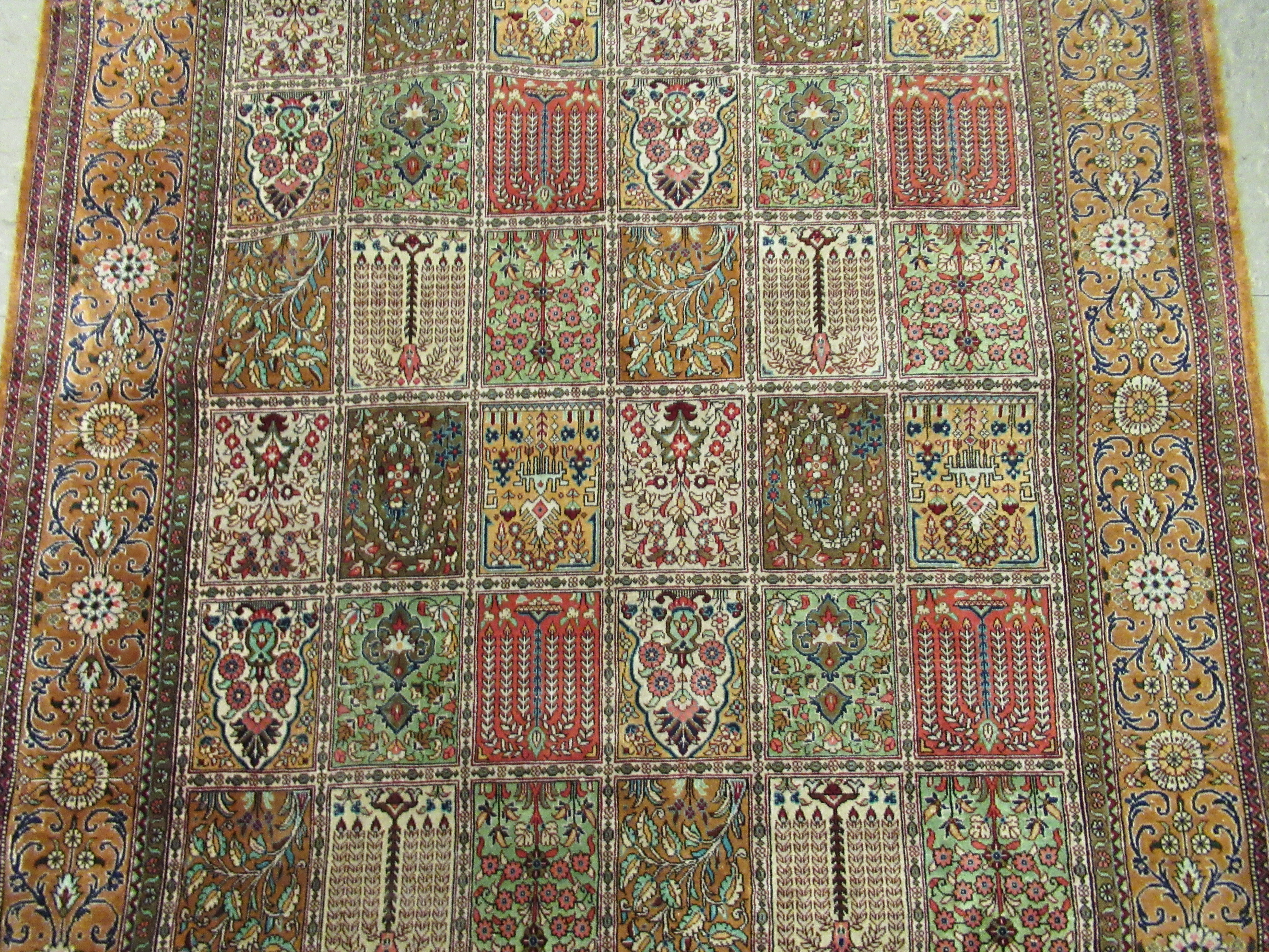 A Persian part silk/part woollen rug, decorated with repeating rectangular panels, - Image 3 of 8