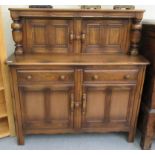 An Ercol Golden Dawn elm court cupboard with two upper doors,