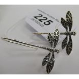 A pair of silver coloured metal dragonfly earrings 11