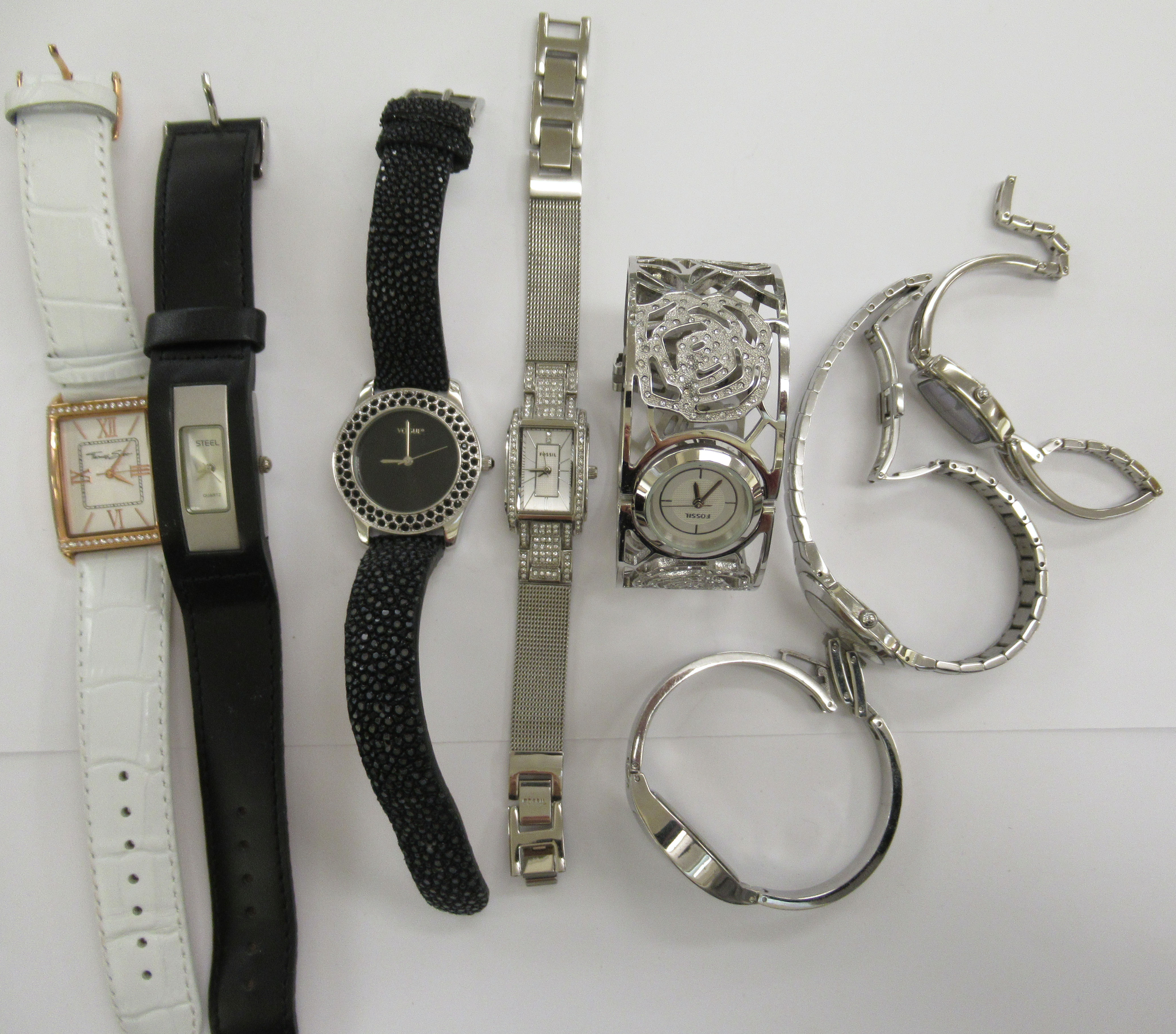 Ladies wristwatches: to include a stainless steel cased fossil bracelet watch with a baton dial