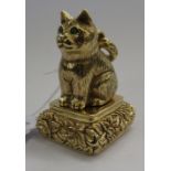A silver gilt pendant seal ornament, fashioned as a seated cat,