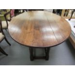 A Jacobean style oak wake table, the top with deep fall flaps,