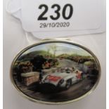 A silver coloured metal oval patch box,