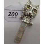 A babies silver coloured metal and mother-of-pearl teether/rattle,