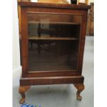 An early 20thC walnut display cabinet with a glazed panelled top and full-height doors,