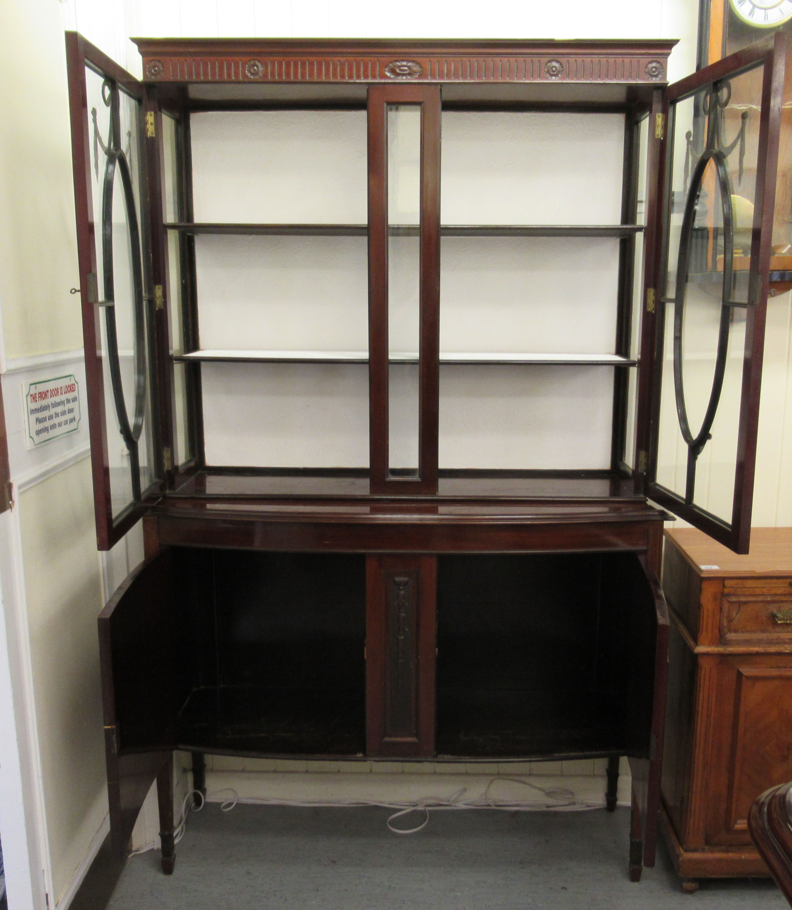 An Edwardian mahogany display cabinet with a pair of glazed doors, over a bow front, - Image 2 of 4