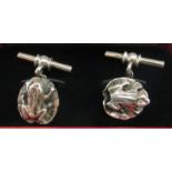 A pair of silver coloured metal cufflinks,