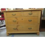 A late Victorian stained pine dressing chest with two short/two long drawers,