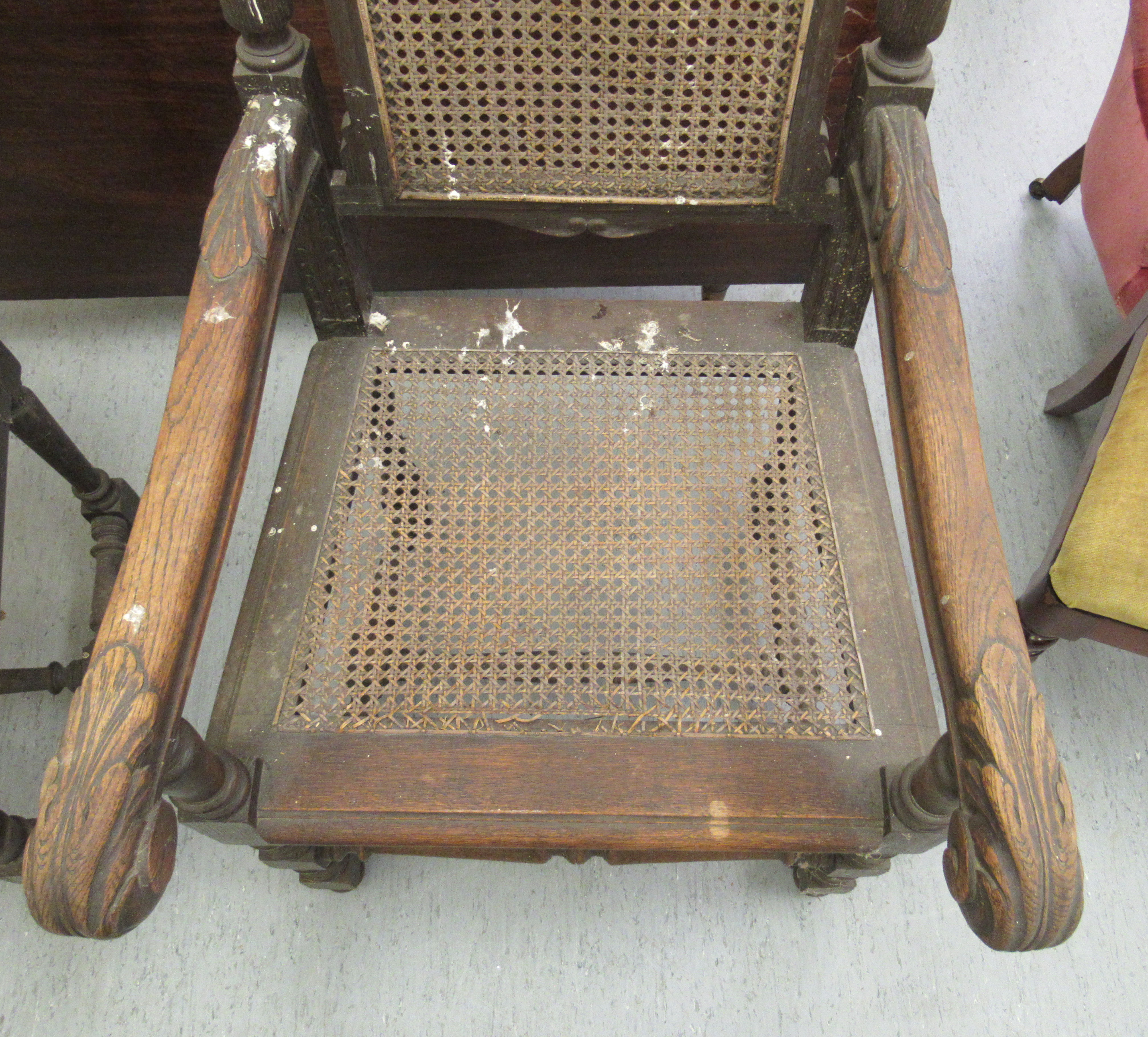 A pair of late 19thC baronial style, oak framed, high back chairs with carved crests, side pillars, - Image 4 of 4