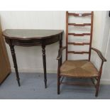 A 1920s stained beech framed ladderback elbow chair,