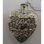 An embossed heart shaped silver coloured metal pendant scent bottle 11
