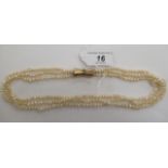 A triple row cultured pearl necklace,