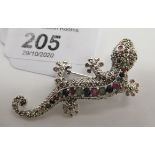 A gold coloured metal lizard brooch,