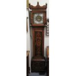 A late 18thC and later oak longcase clock with pokerworked ornament,