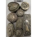 Eight dissimilar silver patch, pin and trinket boxes, variously decorated with embossed,