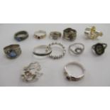 White, gold and silver rings: to include a 9ct example,