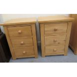 A pair of modern Cotswold Oakley pine three drawer bedside chests,