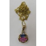 A 9ct gold pendant, set with a blue and a pink sapphire,