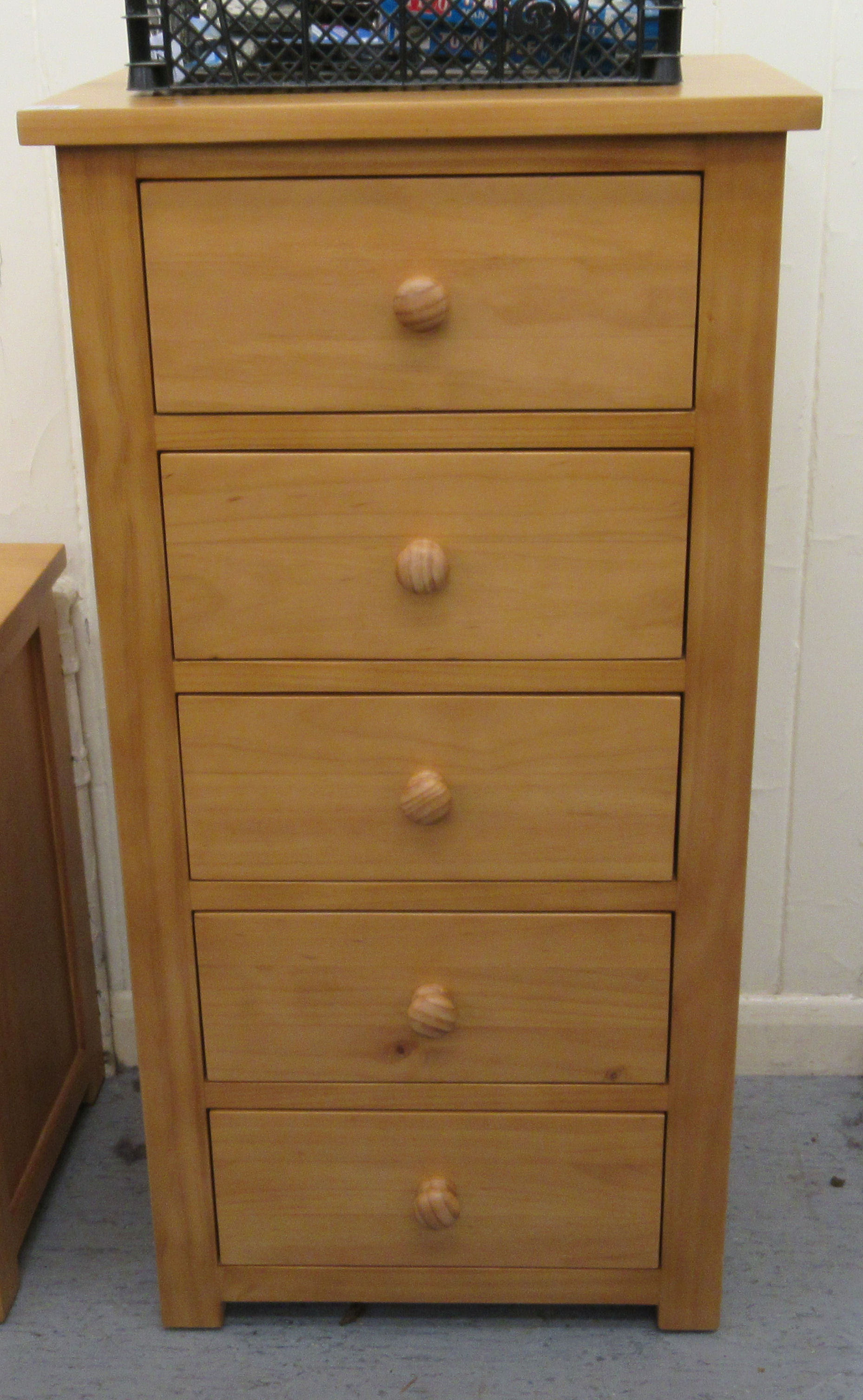 A modern Cotswold Oakley pine five drawer pedestal chest,