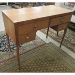 A mid 20thC light oak kneehole dressing table with two short/two long drawers, raised on tapered,