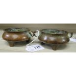 A pair of Oriental cast bronze censer, the shallow, bulbous bowls with opposing loop handles,