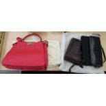 Three handbags by differing designer's: to include a red hide example with original dust bag