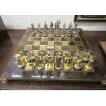 A novelty cast metal chess set,