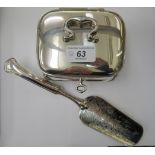 A foreign silver coloured metal casket of ogee form with a folding handle,