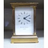 A modern Matthew Norman lacquered brass cased carriage timepiece with pillar uprights,