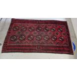 A Bokhara rug, decorated with two columns of seven abstract guls,