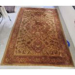 A Persian rug, decorated with floral and foliate designs,