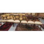 A set of six late Victorian mahogany framed, waisted spoonback dining chairs, the upholstered,