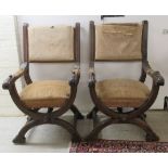 A pair of late 19thC mahogany framed Savonarola inspired armchairs,