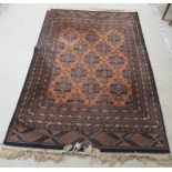 A Belgian machine made rug, decorated with repeating stylised designs,