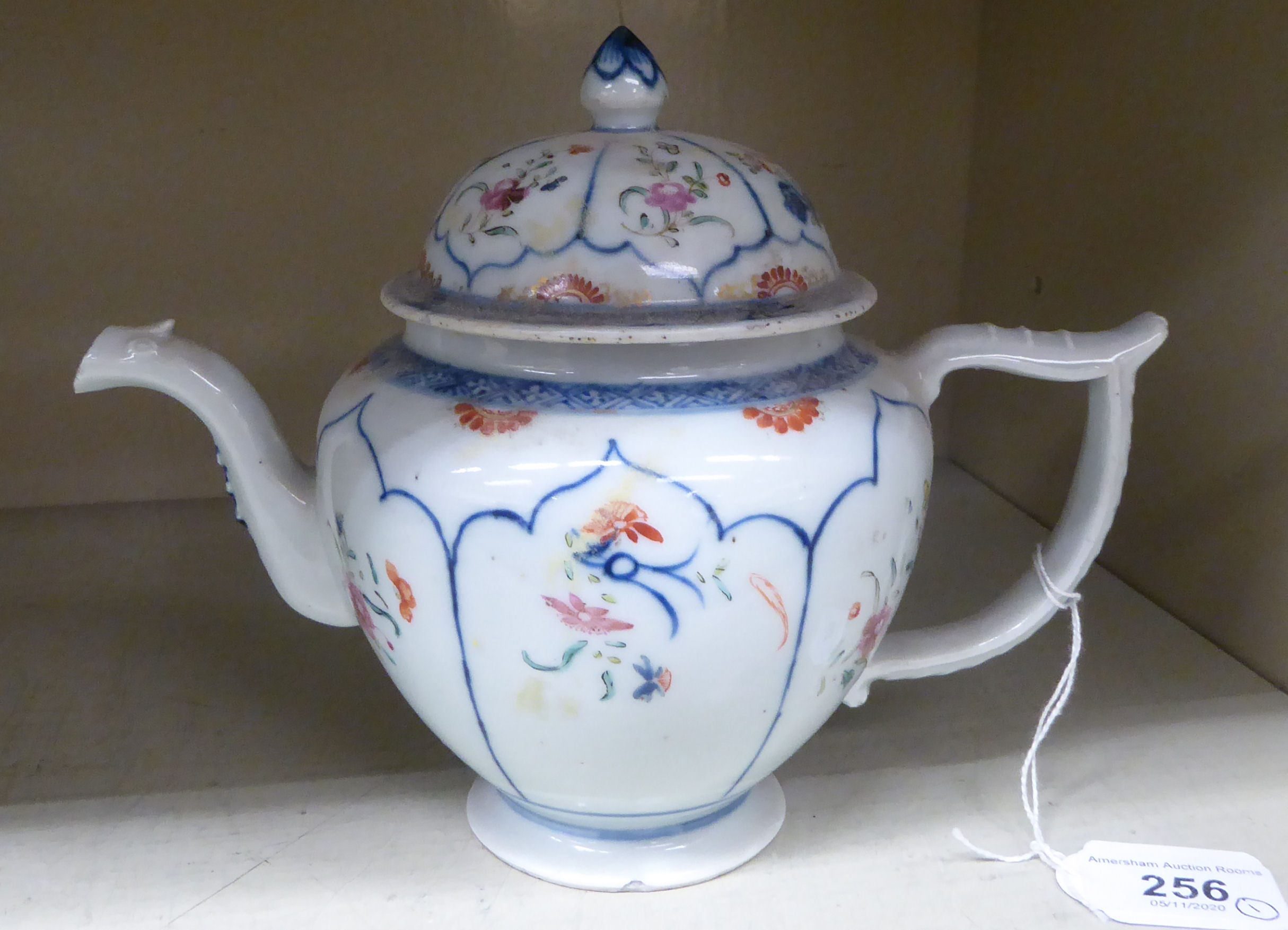 A late 18thC Chinese Export porcelain teapot and cover, decorated with panels of flora 6.