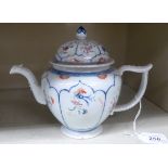 A late 18thC Chinese Export porcelain teapot and cover, decorated with panels of flora 6.