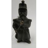 An early 20thC cast and patinated bronze novelty vesta case, fashioned as a standing soldier,