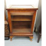 An early 20thC walnut display cabinet with a glazed panelled top and full-height doors,