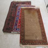 Three European and other rugs, on multi-coloured grounds 33'' x 62'',