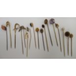 A collection of gold coloured metal and other stickpins: to include one with a pearl;