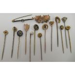 A collection of yellow metal and other stickpins: to include a 9ct gold Mizpah twin heart brooch;