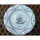 A late 18thC Chinese porcelain plate, decorated with a ship, an armorial and garland drapes,