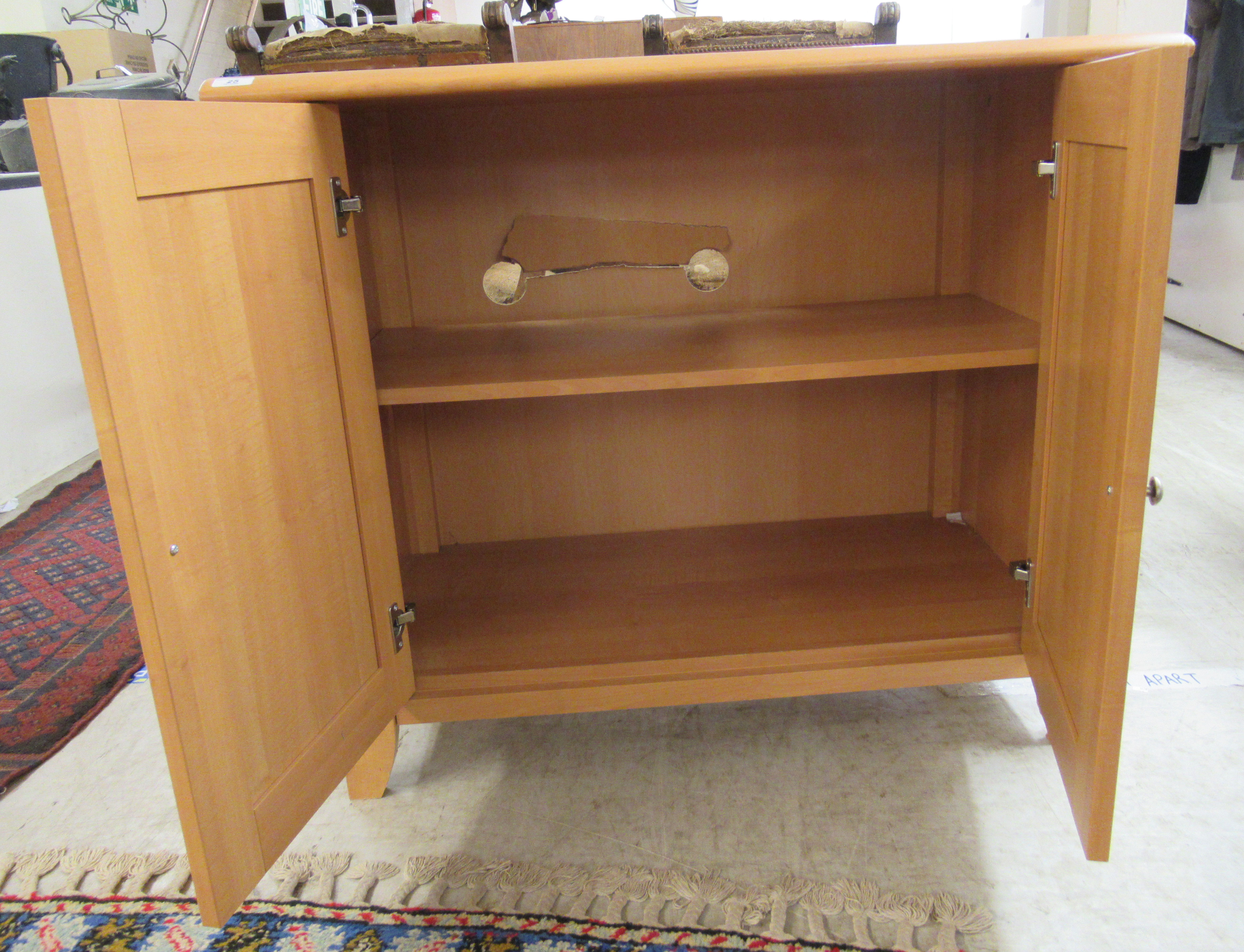 A modern beech cupboard with a pair of doors, enclosing a shelf, - Image 2 of 4