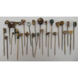 A collection of yellow metal and other stickpins, variously set with pearls,