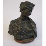 A cast and patinated bronze bust, a classically attired young woman 7.