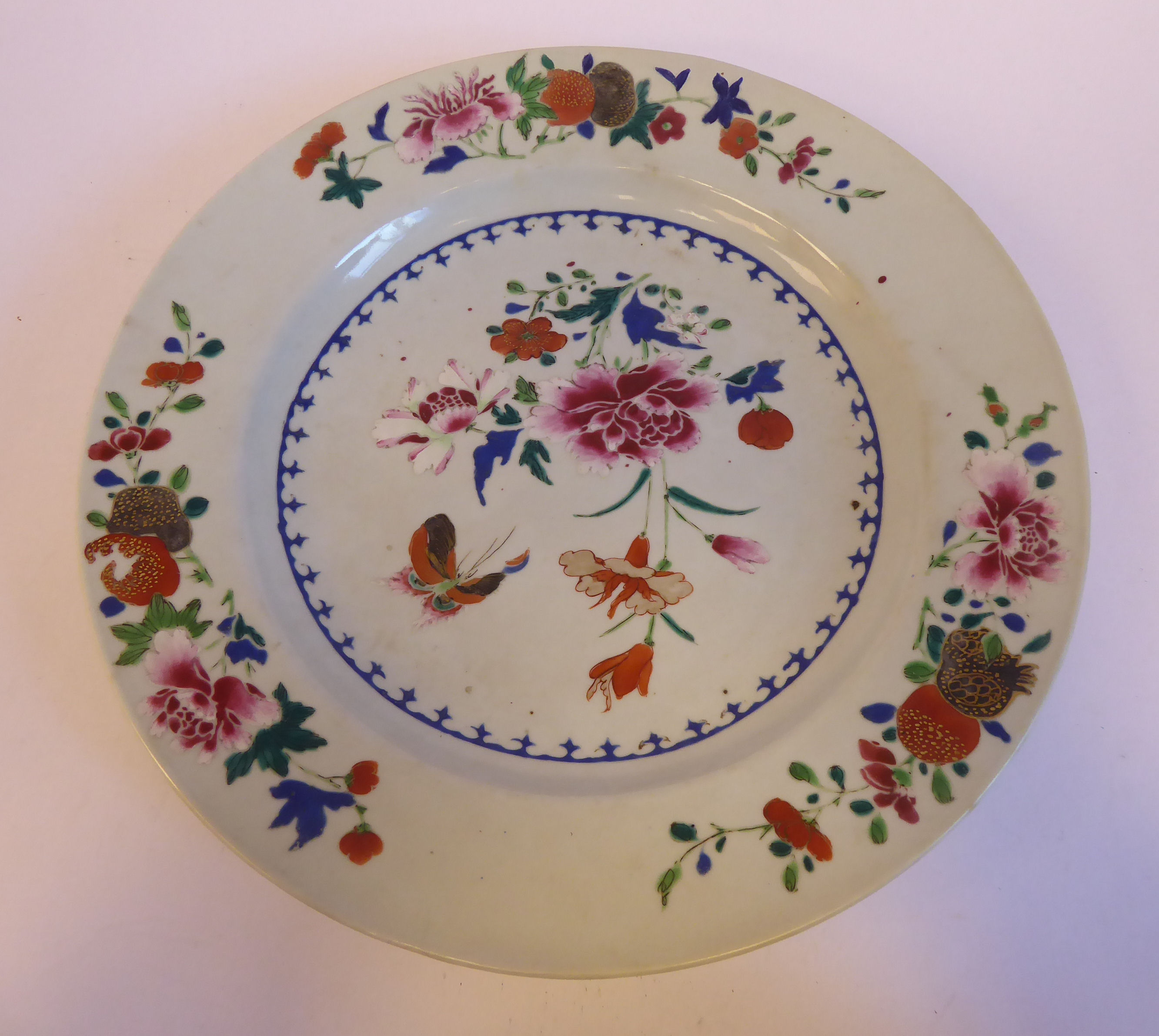 A late 18thC Chinese famille rose, broad rimmed porcelain plate, decorated with flora, - Image 2 of 5