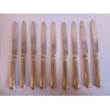A matched set of nine Georgian silver dessert knives, on hollow,
