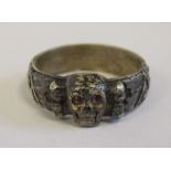 A World War II German silver coloured metal SS ring, decorated with a skull,