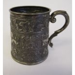 An Indian silver coloured metal Christening tankard of tapered cylindrical form,